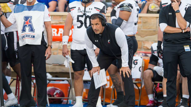 Cincinnati head coach Luke Fickell watching his team from the sidelines